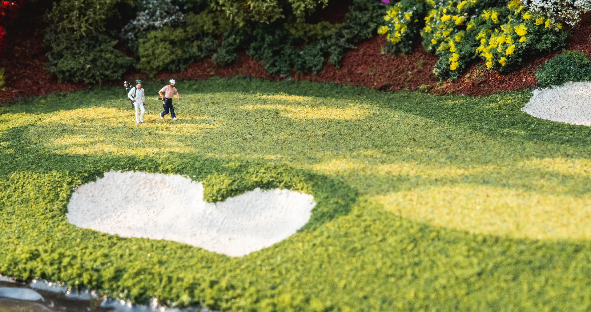 Replica of golfers walking to green micro landscape
