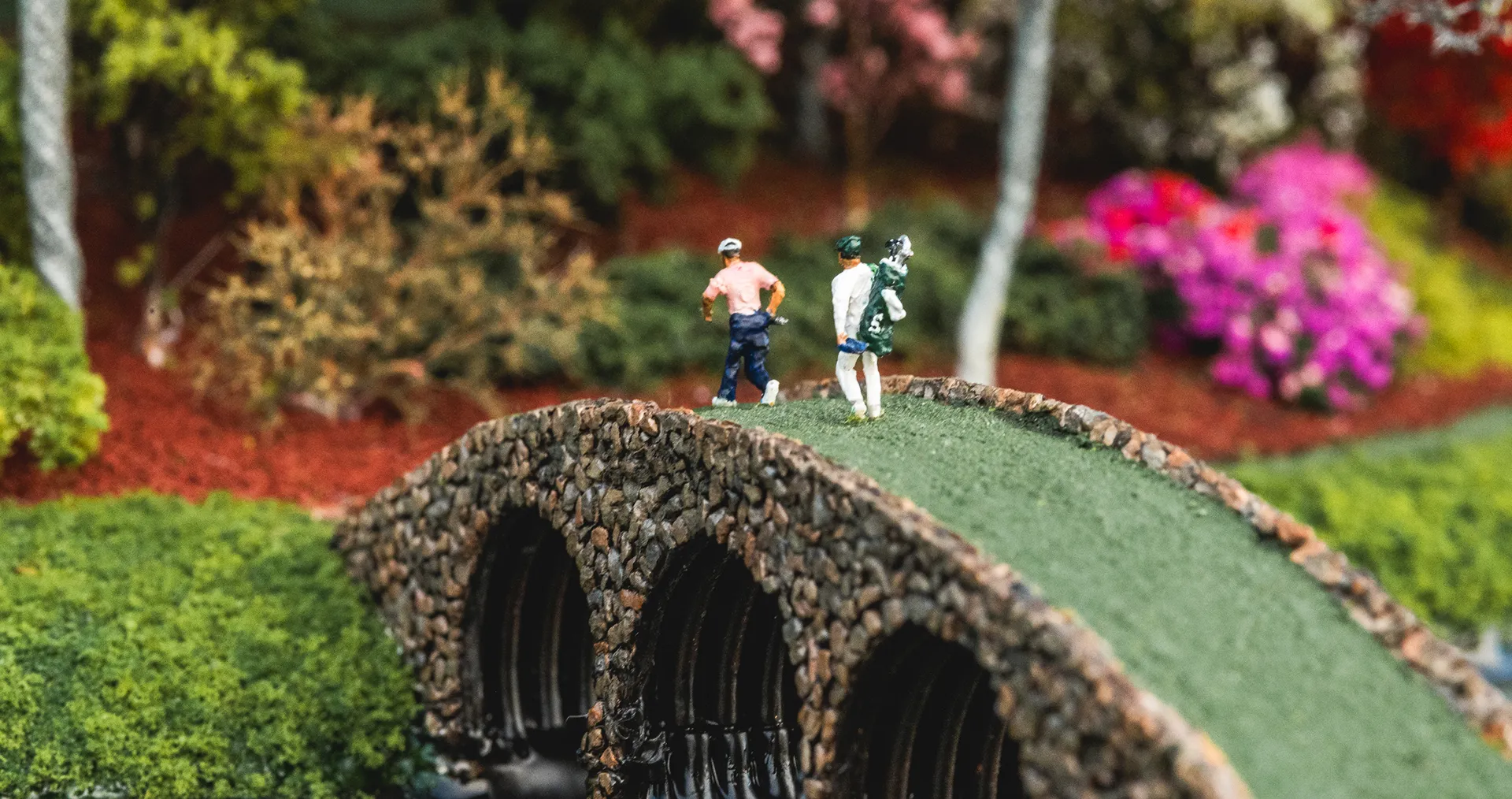 Replica of people walking on bridge micro landscape desktop