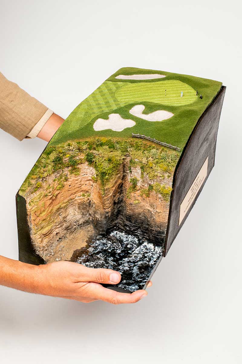 Handcrafted micro landscape of Pebble Beach Hole 6 with detailed California coastline cliffs.