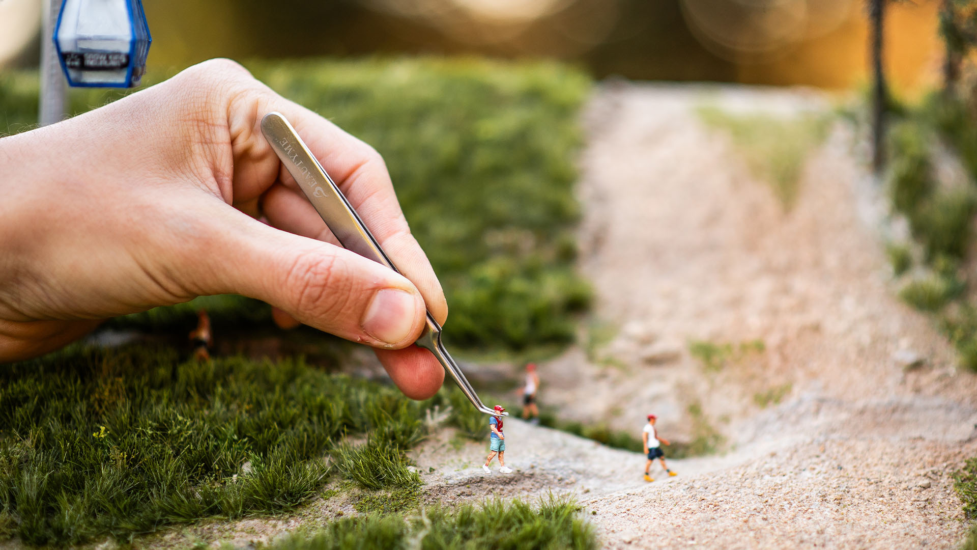 Artist working on the handcrafted Snow King Mountain micro landscape for 29029 Everesting