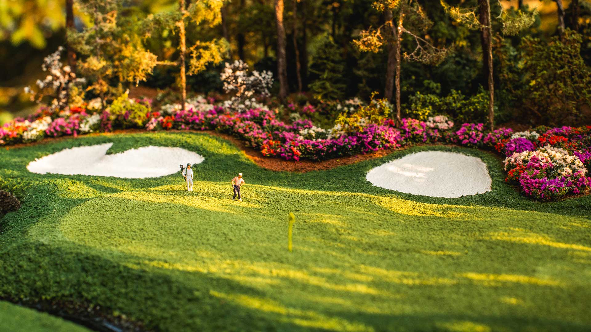Close up of sculpted green contours and realistic turf on a handcrafted golf micro landscape