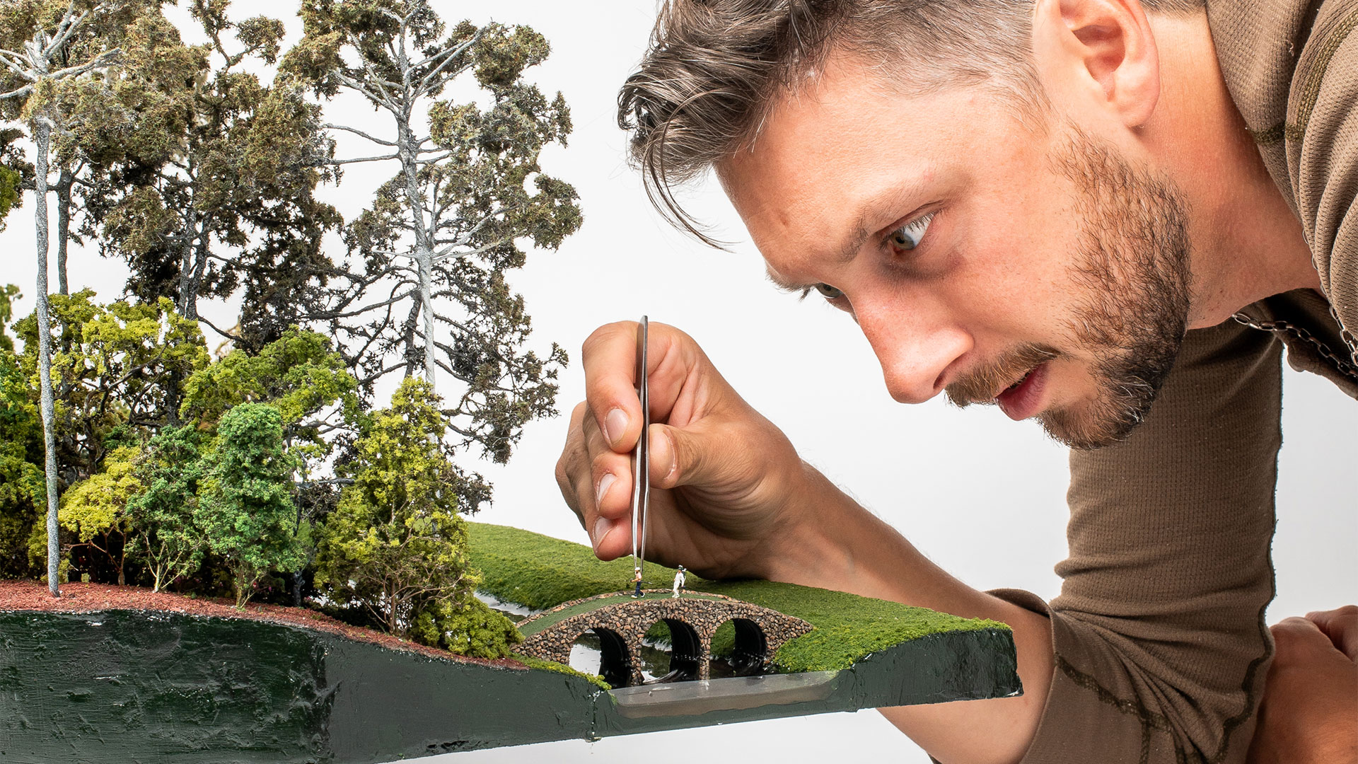 Micro Landscape Architect Working on Golf Course Replica